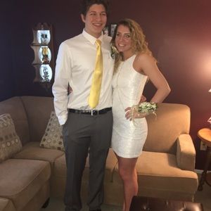 white tight fit dress with gold and silver accents